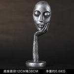 masque sculptural contemporain noir blanc doré finement sculpté base circulaire ornement salon