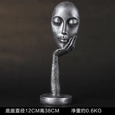masque sculptural contemporain noir blanc doré finement sculpté base circulaire ornement salon