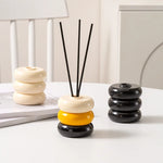 diffuseur huiles essentielles moderne minimaliste rouge jaune bleu noir beige vert géométrique circulaire brillant