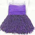 jupe déguisement sequins dorés ruban fixation largeur 16cm polyester violet rouge jaune rose vert