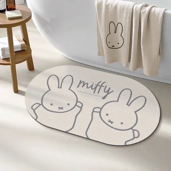 tapis bain dessin animé lapins gris jaune vert bleu rayures enfantin absorbant