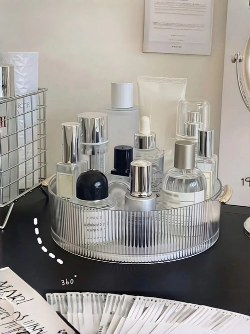 organisateur rotatif transparent cosmétiques parfums rayures verticales moderne poignées dorées brosse maquillage flacon parfum