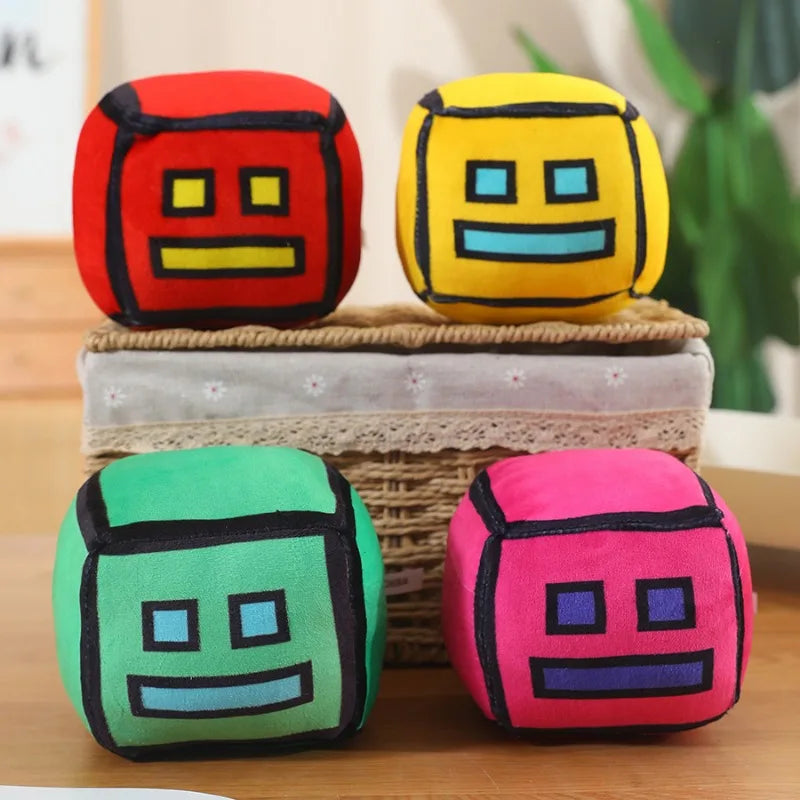 peluche cube dessin animé visage sourire couleur rouge jaune vert rose bleu noir