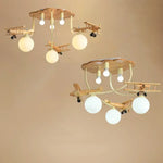 lampe bois naturel avions sphères translucides vintage moderne chambre enfants