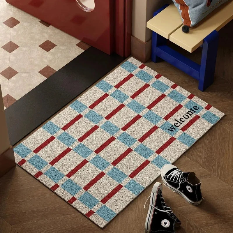tapis d'entrée moderne bleu rouge beige motif carreaux diagonaux texte welcome sweet sol