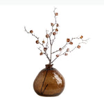 vase transparent brun clair forme arrondie branches fleurs décoration table moderne transparent texture bosselée