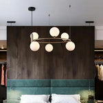 suspension luminaire moderne sphères verre translucides anneau métal doré salon chambre scandinave