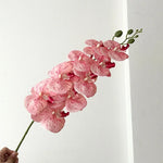 décoration intérieure vase orchidées artificielles fleurs douces feuilles vertes moderne élégant rose blanc violet