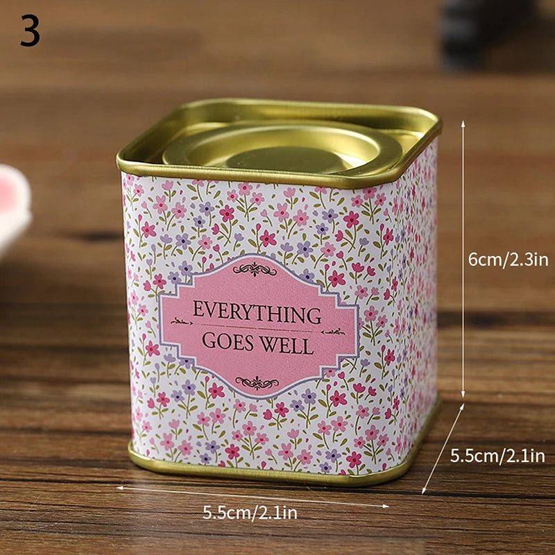 boîtes métal bleu rose noir fleurs vintage capsules étiquettes messages conservation snacks thé