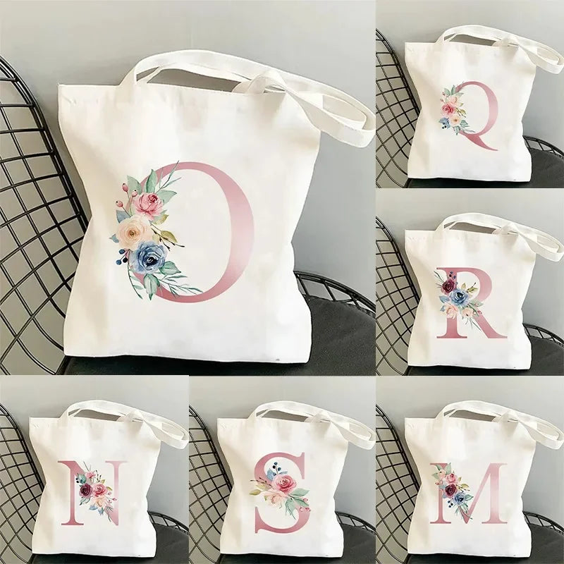 sac main blanc lettre stylisée moderne poignées détachables grandes capacités élégant toile personnalisable voyage