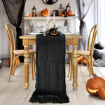 ruban table noir crêpe halloween décorations citrouilles crânes fourchettes assiettes bougies