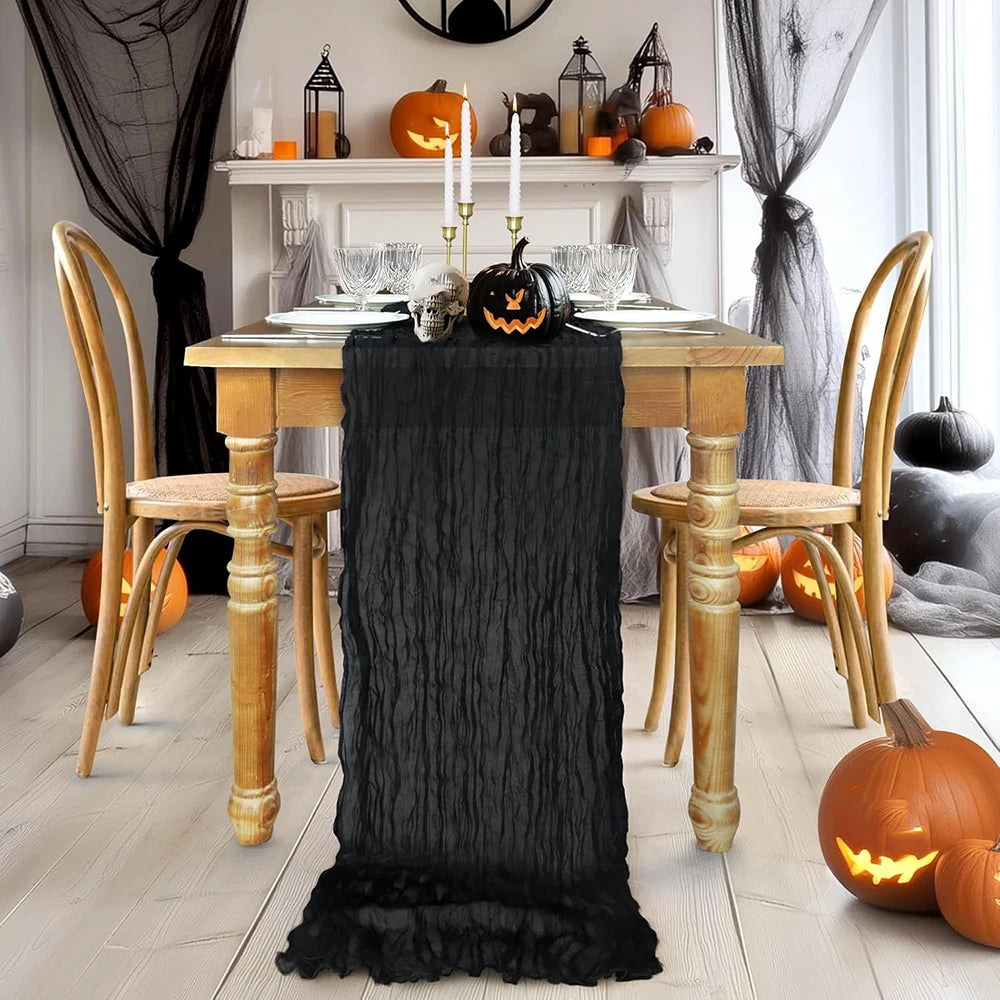 ruban table noir crêpe halloween décorations citrouilles crânes fourchettes assiettes bougies