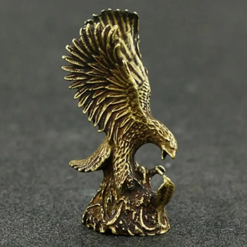 statuette aigle dorée détails fins plumage stylisé décoration artisanal opaque réaliste animal compagnie