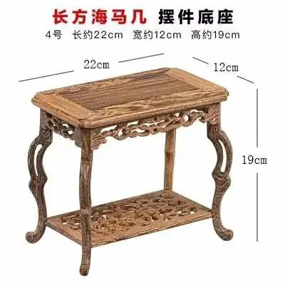 table basse bois rose classique gravures artisanal marron clair pot plante figurine cadre photo