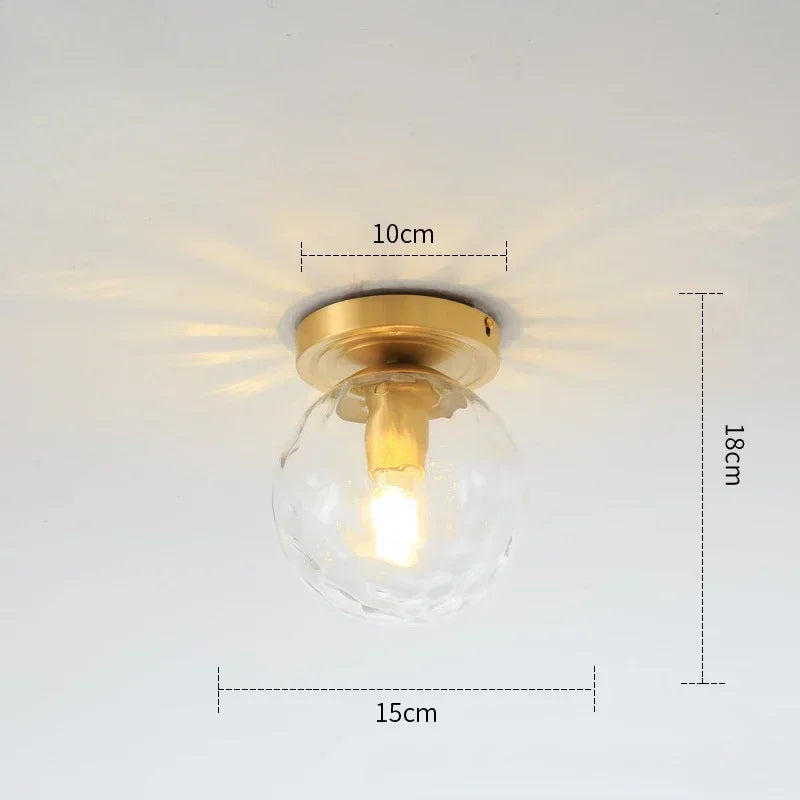 lampe moderne verre transparent noir doré élégante sphérique éclairage contemporain