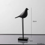 statues oiseaux noir blanc minimaliste sculpture deco intérieur base plate pieds minces