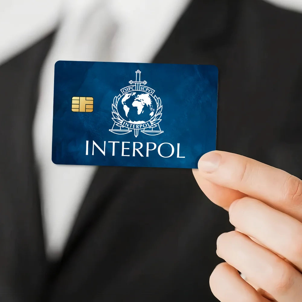 stylo bille bleu interpol logo globe épée carte bancaire
