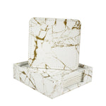 Un jeu de sous-verres élégants avec un motif de marbre blanc et doré créant un design moderne et sophistiqué.