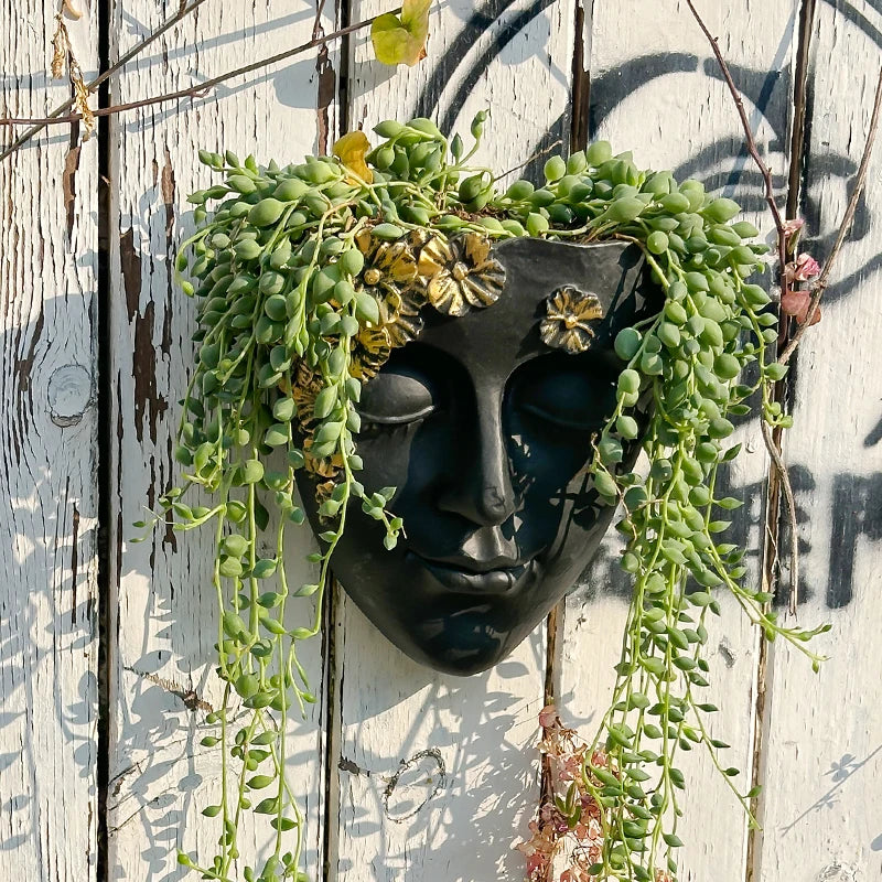 décoration murale résine sculpturale masque noir motif floral doré plante verte fixations