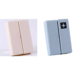 boîte pilules hebdomadaire compartiments couleurs pastel croix blanche moderne pratique