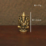 statues ganesha bronze doré sculptures détaillées motifs floraux traditionnel hindou maison