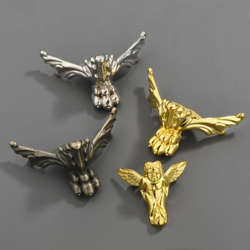 pinces linge vintage ornementées détails sculptés métal doré argenté art nouveau