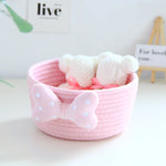 panier rangement rose blanc rayures horizontales noeud décoratif réutilisable polyestère enfantin cordelette organisation jouets