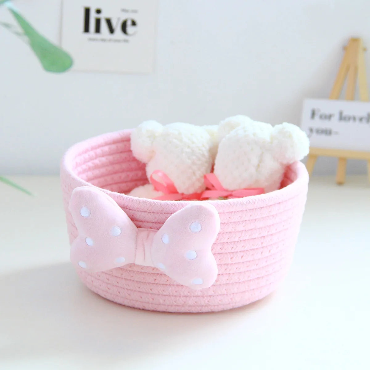 panier rangement rose blanc rayures horizontales noeud décoratif réutilisable polyestère enfantin cordelette organisation jouets