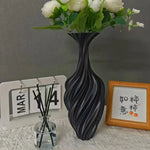 vase moderne décoration intérieure vase texturé noir fleurs artificielles calendrier cadre photo livres parfum