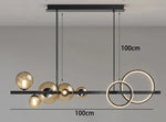suspension lumineuse moderne noir doré verre transparent anneaux lumineux globes contemporains