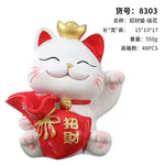 statue chat porte bonheur blanc doré artisanal détails dorés pochette rouge plateau texte rouge