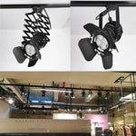 spot lumineux led noir moderne structure métallique fixations barres rigides éclairage accent