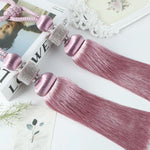pompons rideaux modernes bleu doré rose attaches cordons élégants décoration salon
