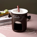 bouilloire chocolat céramique moderne cuillère bois bougie rouge noir blanc