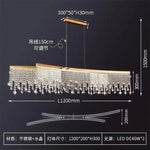 lampe suspendue cristal or moderne élégante chaînes transparentes salon salle manger