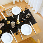 ruban table noir crêpe halloween décorations citrouilles crânes fourchettes assiettes bougies