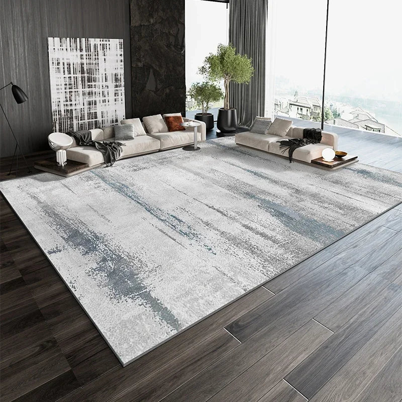 Un élégant salon moderne avec de grands canapés confortables, des décorations minimalistes et de grands panneaux vitrés offrant une vue panoramique sur un paysage extérieur.