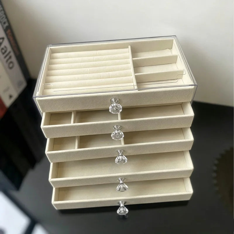 boîte bijoux moderne beige velours transparent tiroirs rangement chic poignées boucles d'oreilles montres
