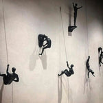 statues métal noir sculptures humaines diverses postures art moderne decoration murale