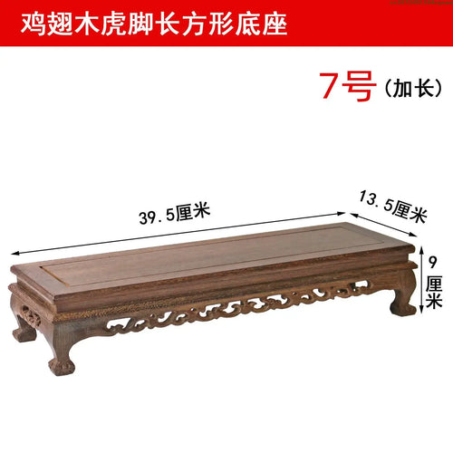 table basse bois sculptée classique marron foncé vases statuette