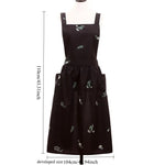 tablier cuisine noir fleurs blanches coton polyester plissé croisé dos poches classique imperméable