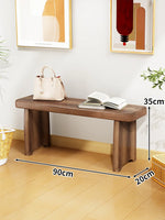 Banc bois marron clair texture naturelle moderne salon tabouret sac main livre ouvert decoration