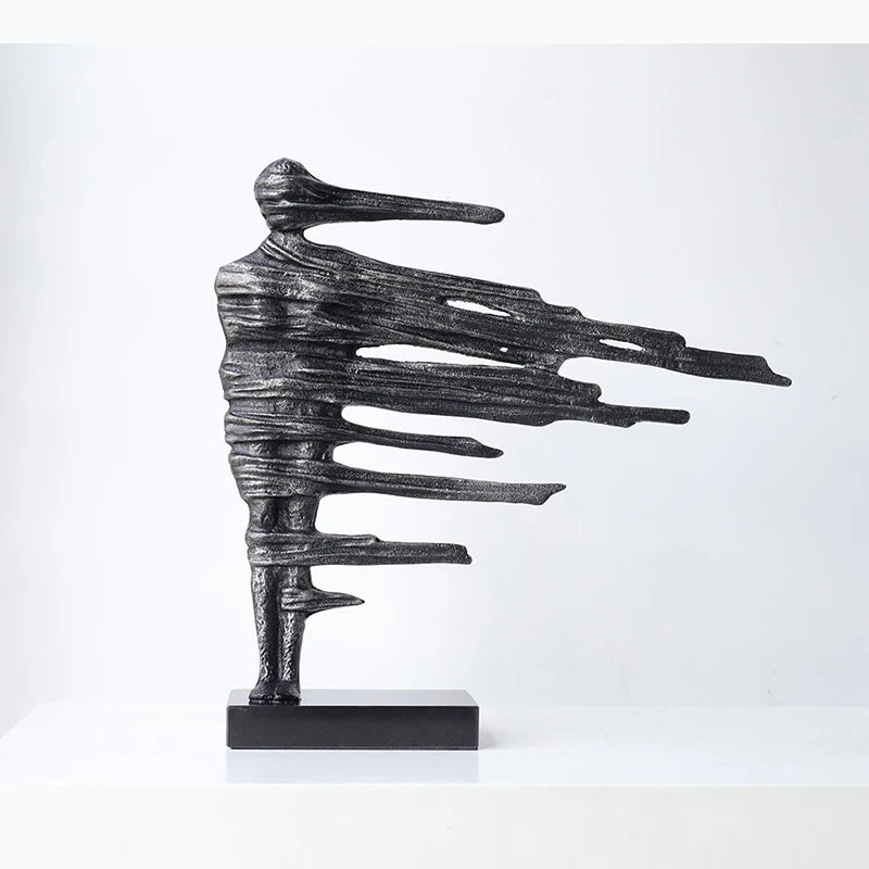 sculpture moderne abstraite figures noires texture rugueuse ligne horizontale décoration intérieure chambre