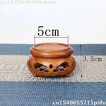 support bois sculpté vintage marron clair découpes décoratives artisanat traditionnel stand thé pot