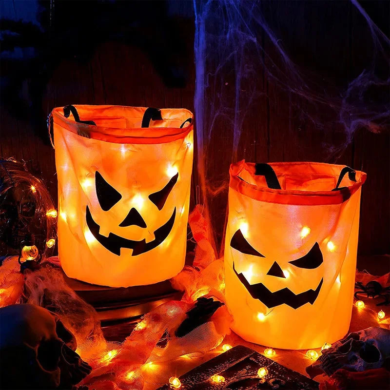sac lumineux citrouille halloween orange noir motif yeux triangles LED enfants festif