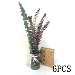 bouquets pampas marron clair beige blanc feuilles vertes plumes blanches décoration intérieure mariage boho