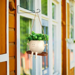 pots fleurs suspendus resine forme personnages souriants balançoire crème marron