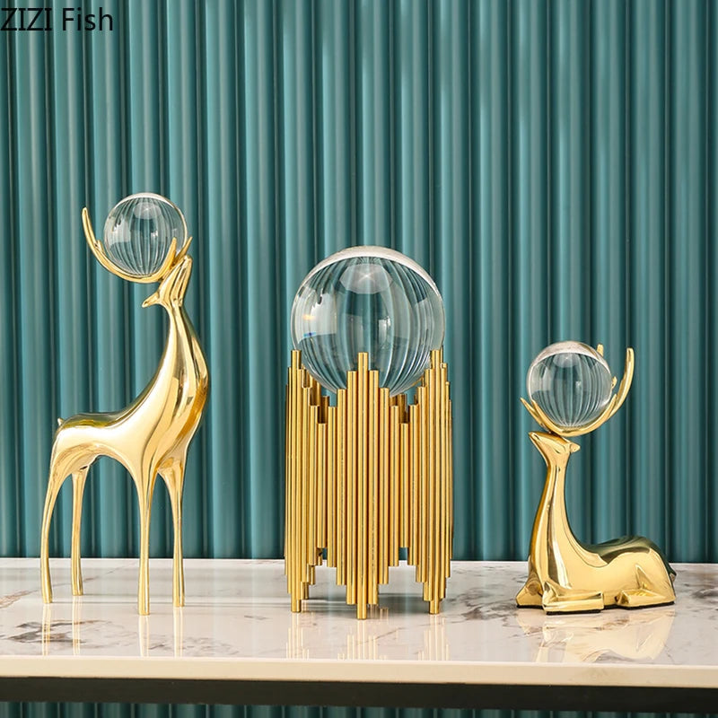 statues cerfs dorées boule cristal moderne décoration vase fleurs artificielles tableau noir