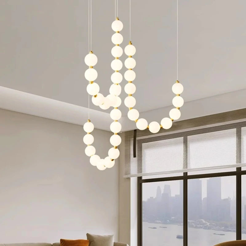 suspension lumineuse moderne minimaliste cactus blanc opalescent câbles dorés chambre salon