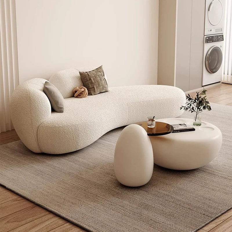 canapé lit blanc bouclé moderne table basse coussins décoratifs